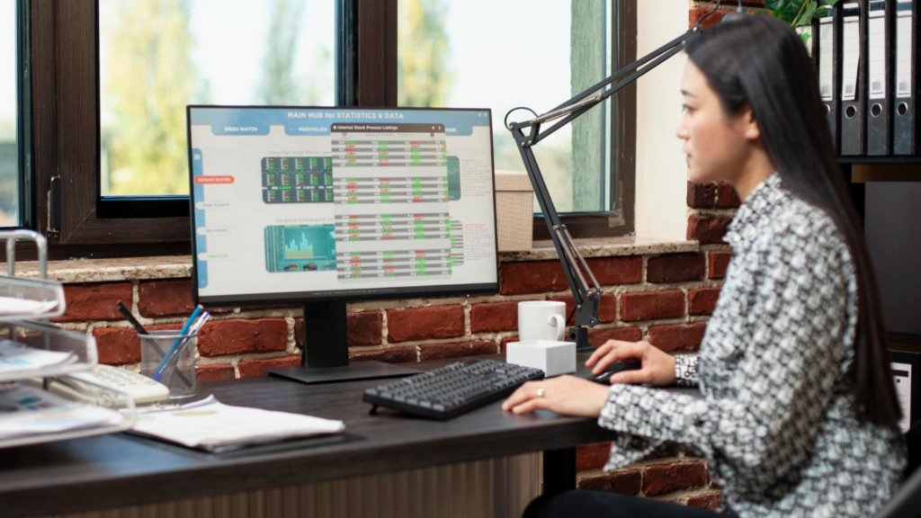 Woman reviewing business data reports